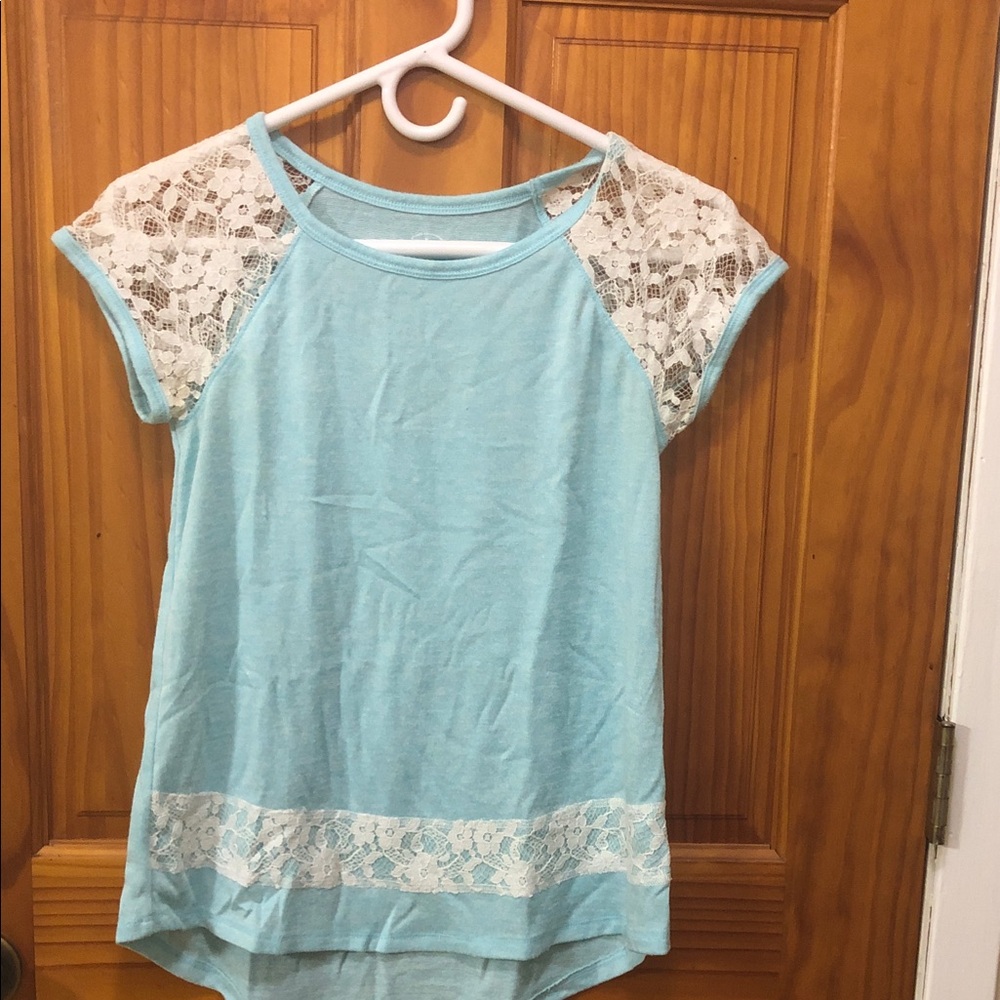 Girl’s light blue shirt w/ white lace
